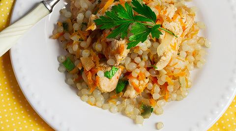 Fried Rice made with organic, odorless, low carb GoSkinny Noodles Rice konjac rice (shirataki) on white plate with yellow napkin