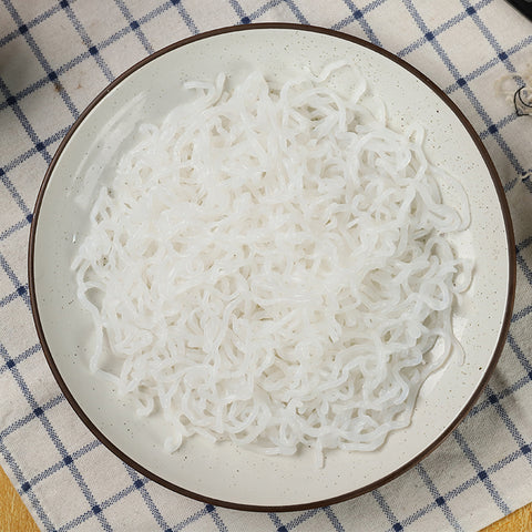 Plain Organic GoSkinny Noodles Spaghetti shirataki on white plate
