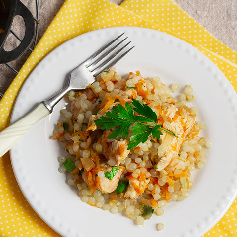 Fried Rice made with odorless, organic, low carb GoSkinny Noodles Rice konjac rice (shirataki) on white plate with yellow napkin