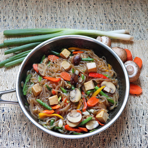 Tofu and Veggie Stir Fry featuring low carb Organic GoSkinny Noodles Spaghetti, beside green onions, mushrooms, and sliced carrots