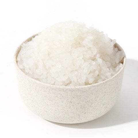 White bowl full of odorless, organic, low carb GoSkinny Noodles Rice konjac rice (shirataki)
