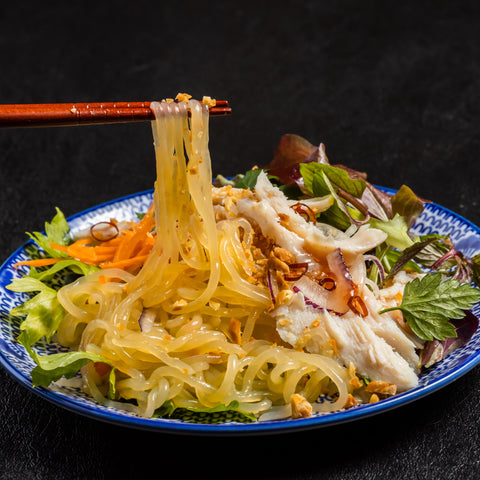 Salad in blue bowl with odorless, organic, keto GoSkinny Noodles Spaghetti konjac noodles (shirataki)